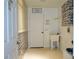 Functional laundry room features a utility sink and laundry-themed wall decor at 926 Chula Ct, Lady Lake, FL 32159