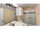 Bathroom features a vanity with double sinks, a shower/tub combo, and tiled walls with black diamond accents at 934 Westpark Dr, Celebration, FL 34747