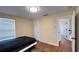 Well-lit bedroom with a window, closet, and neutral walls, with a doorway leading to the rest of the house at 934 Westpark Dr, Celebration, FL 34747