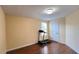 Bedroom with hardwood floors, a window, and a door, suitable for a home gym at 934 Westpark Dr, Celebration, FL 34747