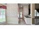 Hallway with tile floors and floral wallpaper at 934 Westpark Dr, Celebration, FL 34747