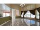 Open-concept living room with tile floors, fireplace, and large windows at 934 Westpark Dr, Celebration, FL 34747
