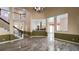 Open-concept living room with tile floors, staircase, and view of the kitchen at 934 Westpark Dr, Celebration, FL 34747