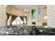 Bright living room features large windows, fireplace, and unique mural accent wall at 934 Westpark Dr, Celebration, FL 34747