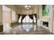 Spacious living room with tile floors, fireplace, and large windows offering ample natural light at 934 Westpark Dr, Celebration, FL 34747