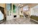Open-concept living room with tile floors, fireplace, staircase at 934 Westpark Dr, Celebration, FL 34747