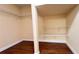 Walk-in closet with hardwood floors and wire shelving for optimal storage at 934 Westpark Dr, Celebration, FL 34747
