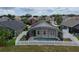 Aerial view of a screened-in pool and fenced backyard at 973 Corvina Dr, Davenport, FL 33897