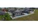 Aerial view of a screened pool in a fenced backyard, ideal for privacy at 973 Corvina Dr, Davenport, FL 33897