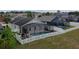 Aerial view of fenced backyard featuring a pool and screened lanai at 973 Corvina Dr, Davenport, FL 33897