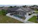 Home with solar panels, a screened-in pool, and a fenced backyard at 973 Corvina Dr, Davenport, FL 33897