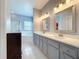 Bathroom with a soaking tub, shower, and a double sink vanity at 973 Corvina Dr, Davenport, FL 33897