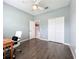 Empty bedroom with ceiling fan, double closet and wood look floors at 973 Corvina Dr, Davenport, FL 33897