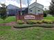 Welcoming community sign with lush landscaping and well-maintained grounds at 973 Corvina Dr, Davenport, FL 33897