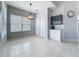 Bright dining area features tile floors, large window and a decorative pendant light fixture at 973 Corvina Dr, Davenport, FL 33897