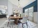 Elegant dining room featuring a wooden table with modern chairs and stylish light fixture at 973 Corvina Dr, Davenport, FL 33897