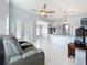 Open concept living area with kitchen, tile floors and vaulted ceilings at 973 Corvina Dr, Davenport, FL 33897