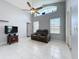Spacious living room features high ceilings, clerestory window and tile flooring at 973 Corvina Dr, Davenport, FL 33897