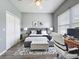 Bedroom with area rug, study desk, and large picture window at 973 Corvina Dr, Davenport, FL 33897