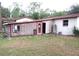 Backyard with attached structure featuring windows with AC units at 12019 Ne 212Th Street Rd, Fort Mc Coy, FL 32134