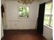 Dining room with wood floors, a chandelier and wainscotting at 12019 Ne 212Th Street Rd, Fort Mc Coy, FL 32134