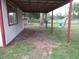 Covered patio with metal supports and views of the yard at 12019 Ne 212Th Street Rd, Fort Mc Coy, FL 32134