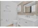 Clean bathroom featuring a modern vanity, stylish mirror, and sleek fixtures for a refreshing experience at 14287 E Weymouth Run, Orlando, FL 32828