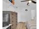 Bright bedroom with a ceiling fan, wood floors, closet storage, and space for entertainment at 14287 E Weymouth Run, Orlando, FL 32828
