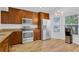 Modern kitchen with granite countertops, stainless steel appliances, and bright lighting at 14287 E Weymouth Run, Orlando, FL 32828
