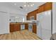 Updated kitchen features stainless steel appliances and wooden cabinetry with ample storage at 14287 E Weymouth Run, Orlando, FL 32828