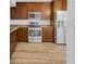 Kitchen featuring wooden cabinets, stainless steel appliances, and modern flooring at 14287 E Weymouth Run, Orlando, FL 32828