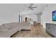 Open-concept living area with a kitchen pass-through, providing ample natural light and space at 14287 E Weymouth Run, Orlando, FL 32828