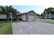 Charming one-story home with brick-paved driveway and attached garage and manicured landscaping at 1749 Christina Lee Ln, St Cloud, FL 34769