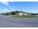 Well-maintained single-story home with attached garage, manicured lawn and paved driveway at 1749 Christina Lee Ln, St Cloud, FL 34769