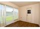 Bright sunroom with wood floors and sliding glass doors to the backyard at 1749 Christina Lee Ln, St Cloud, FL 34769