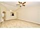 Bright living room featuring vaulted ceilings, wood floors, and an open view to the kitchen at 1749 Christina Lee Ln, St Cloud, FL 34769