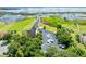 Aerial view of boat parking and waterfront with a gazebo on the pier at 1810 Lee Janzen Dr, Kissimmee, FL 34744