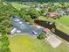 Aerial view of community boat and RV storage area with dock at 1810 Lee Janzen Dr, Kissimmee, FL 34744