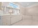 Bathroom features a double vanity, soaking tub and tile floors at 1810 Lee Janzen Dr, Kissimmee, FL 34744