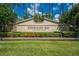 Kissimmee Bay Country Club sign with colorful flowers and lush greenery at 1810 Lee Janzen Dr, Kissimmee, FL 34744