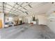 Spacious garage with shelving, utility sink, and water heater at 1810 Lee Janzen Dr, Kissimmee, FL 34744
