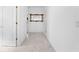 Bright hallway with tile floors offers access to various rooms at 1810 Lee Janzen Dr, Kissimmee, FL 34744