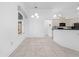 Bright kitchen area with tile flooring, neutral walls, and ample counter space at 1810 Lee Janzen Dr, Kissimmee, FL 34744