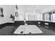 Kitchen featuring a dual bowl sink, speckled granite countertops, and open design at 1810 Lee Janzen Dr, Kissimmee, FL 34744