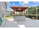 Outdoor bar area on screened-in patio offers a fun spot for entertaining guests at 1810 Lee Janzen Dr, Kissimmee, FL 34744