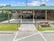 Community pavilion featuring picnic tables and benches, a perfect gathering space for the community at 1810 Lee Janzen Dr, Kissimmee, FL 34744