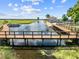 Community waterfront area featuring covered gazebos and docks, perfect for enjoying the water at 1810 Lee Janzen Dr, Kissimmee, FL 34744