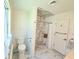 Bathroom featuring a marble shower, white fixtures, and a modern design at 1921 Japonica Rd, Winter Park, FL 32792
