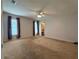 Large bedroom features neutral carpet, two windows and ample space for a comfortable retreat at 1921 Japonica Rd, Winter Park, FL 32792