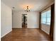 Inviting dining room with wood floors, chandelier, and convenient access to the kitchen at 1921 Japonica Rd, Winter Park, FL 32792